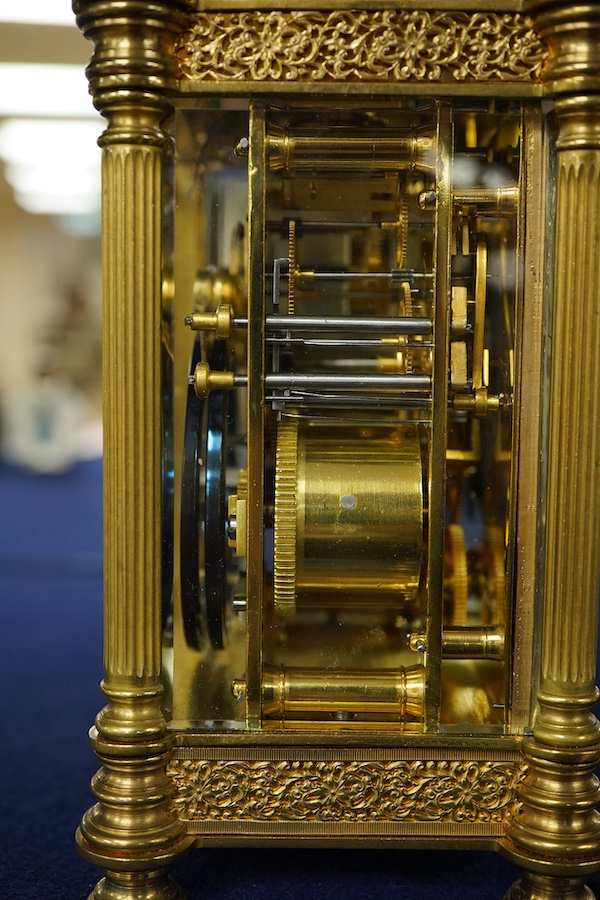 An early 20th century champleve enamel repeating carriage clock with subsidiary dial, with key, 19cm high